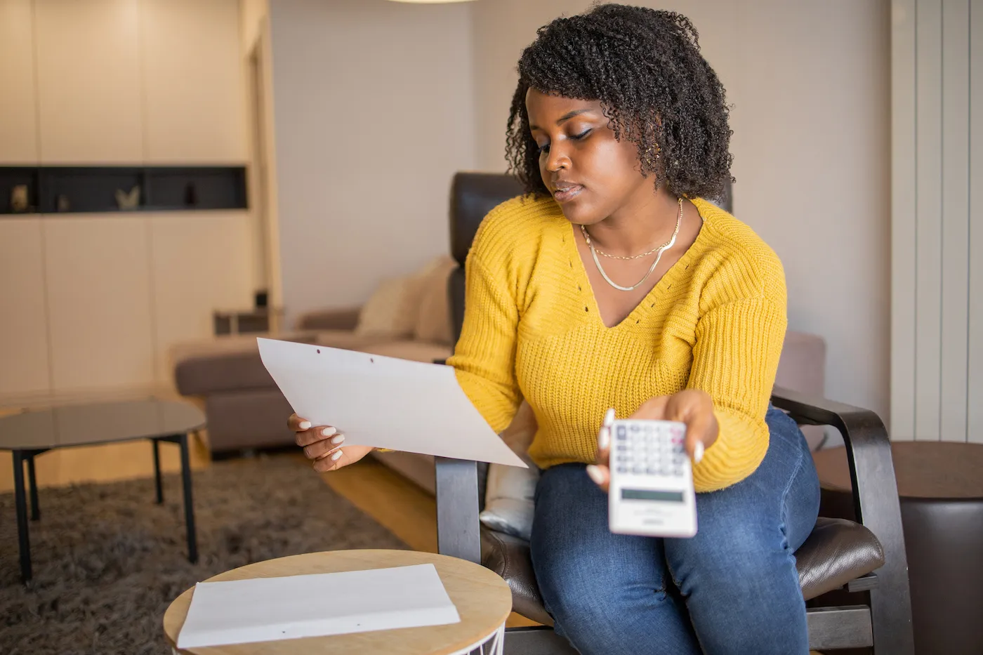 Woman calculating savings account interest rates.