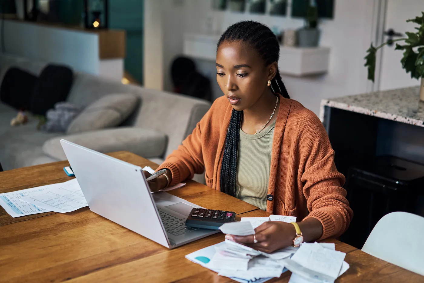 A woman sitting at her desk going through her finances, checking her high yield CD.