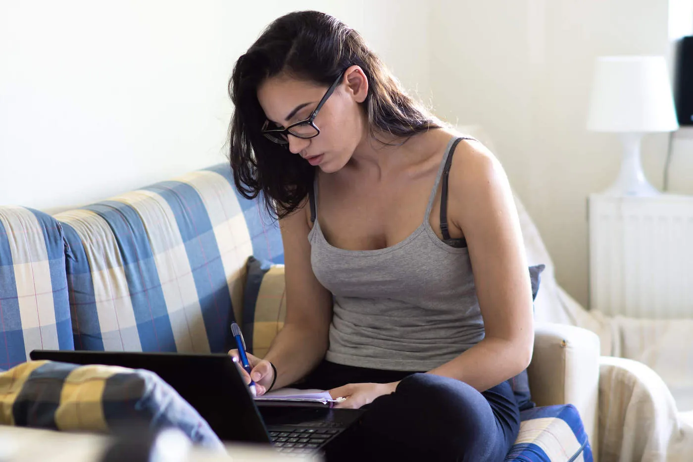 Woman recording state of student loans.