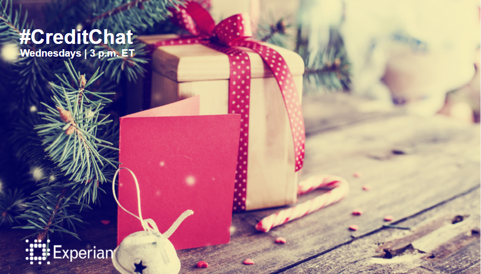 Christmas present and card surrounded by pine leaves, a bell and candy canes