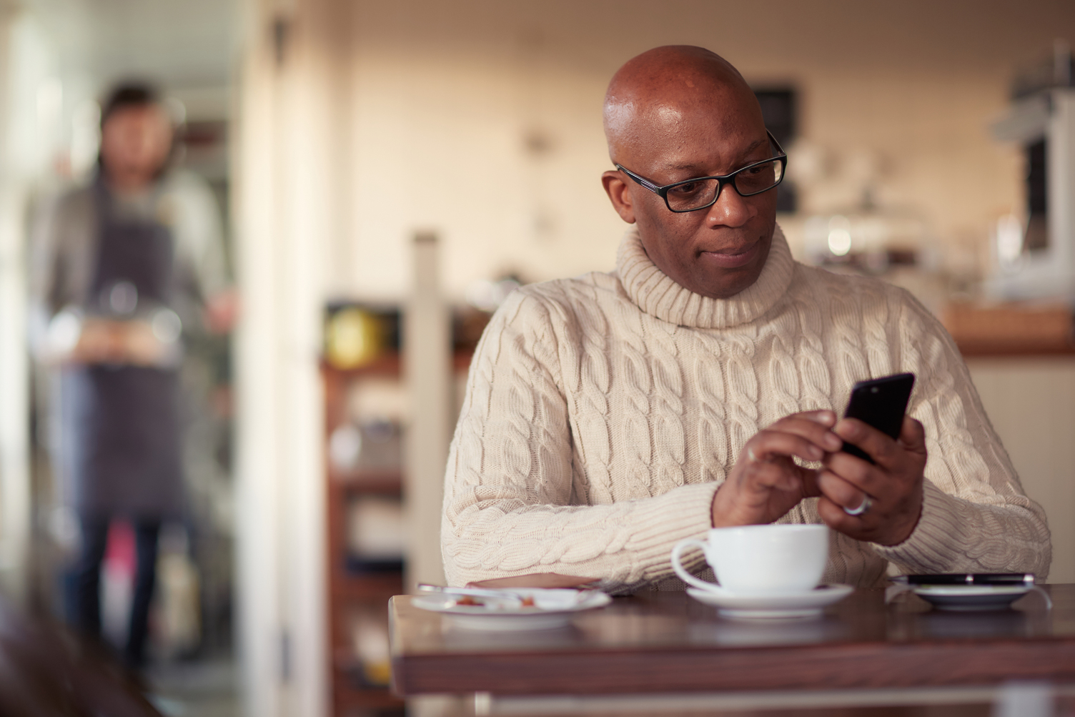 Man sitting and looking at his phone