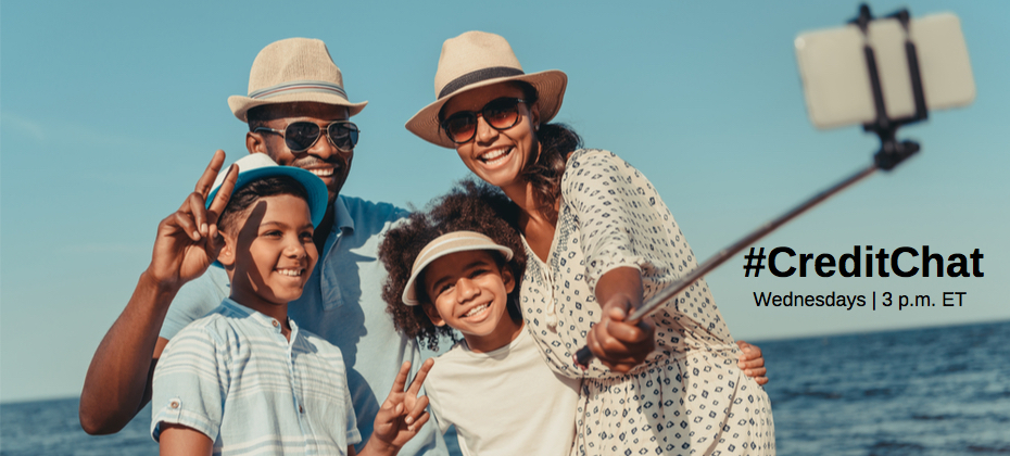 Family of four taking a selfie on vacation