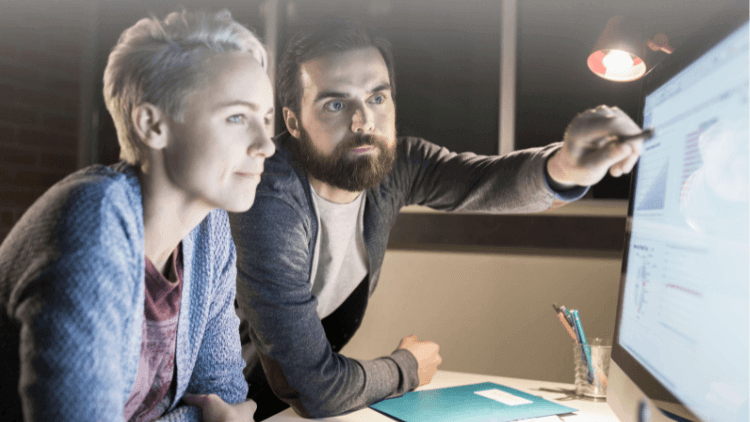 two people looking at screen