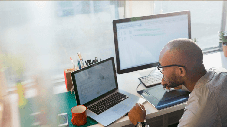 couple checking email on laptop