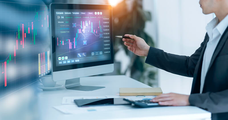 people-talking-in-front-off-data-on-monitors