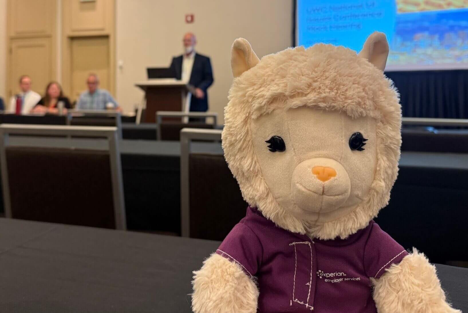 wayne rottger speaks in the background of an employer services no-drama llama