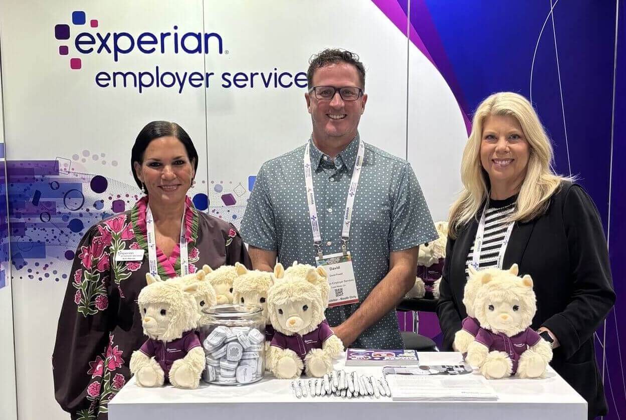3 attendees are at a booth for employer services at ashhra
